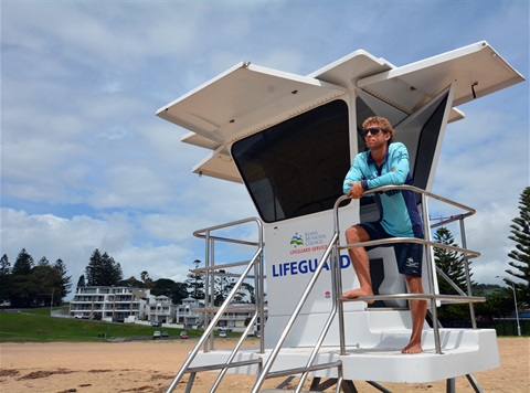 Lifeguard on watch on tower