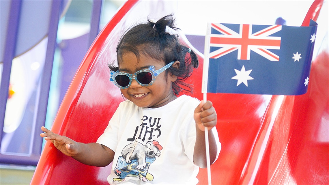 young-girl-with-sunnies-on-slide-copy