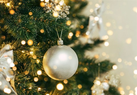 christmas tree with pretty white and yellow lights and white silvery bauble