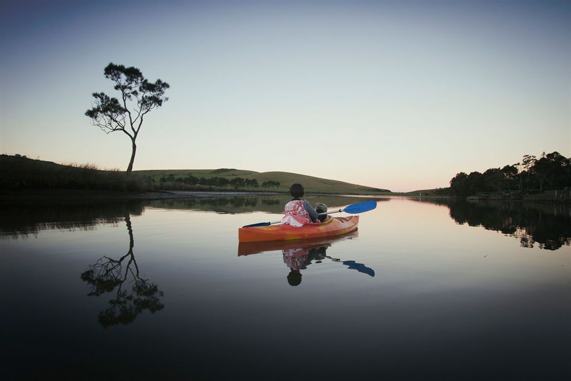 werri laggon at dawn, with single kayaker