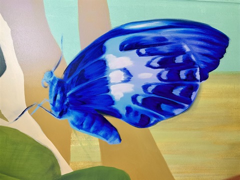 painted blue butterfly on mustard and mint abstract background