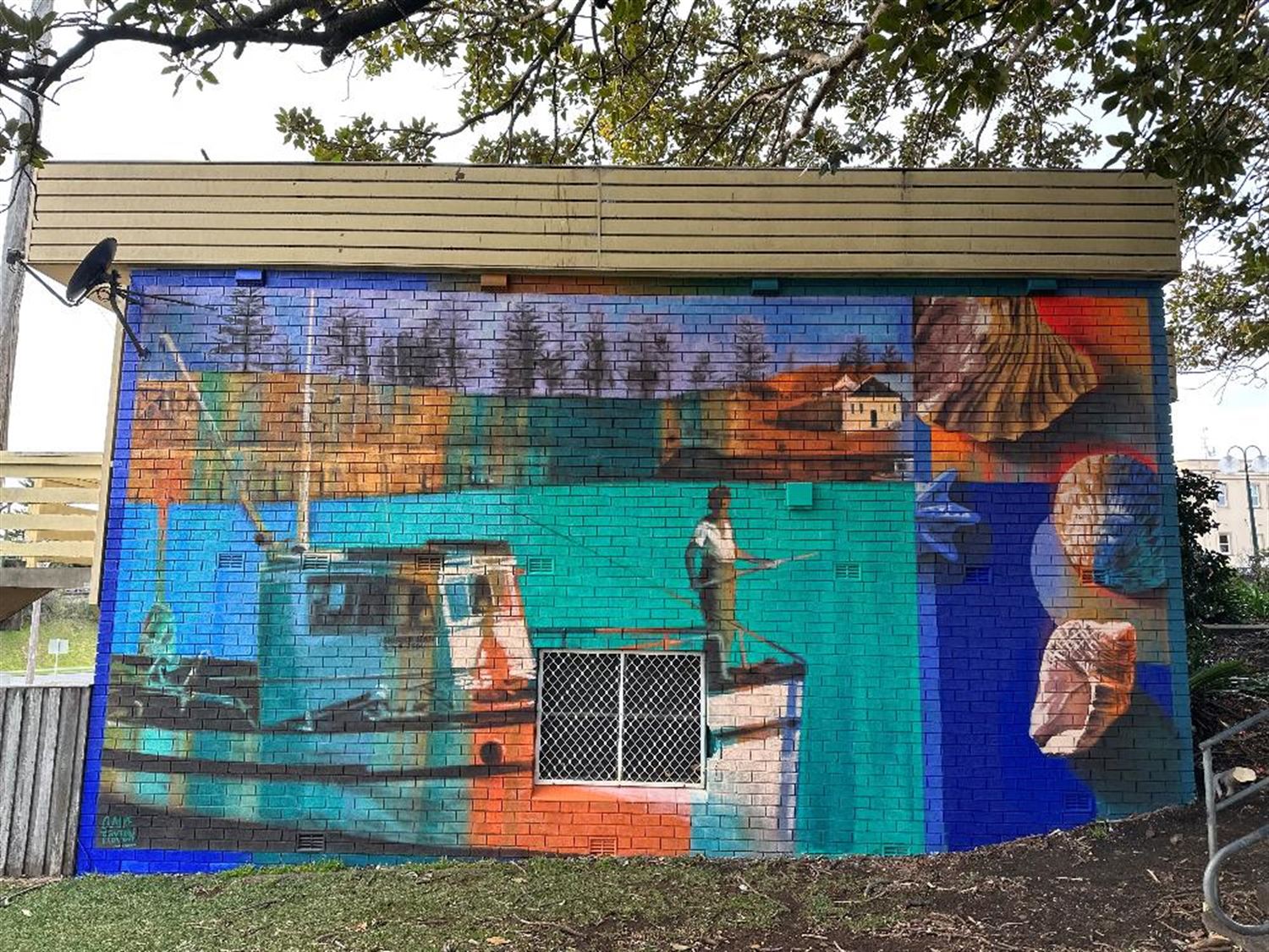 Mural of a man standing on a fishing boat in kiama